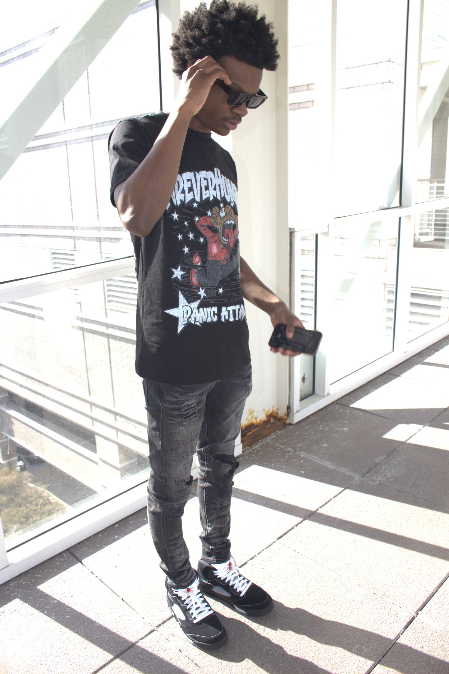 Person wearing a graphic t-shirt 'panic attack'