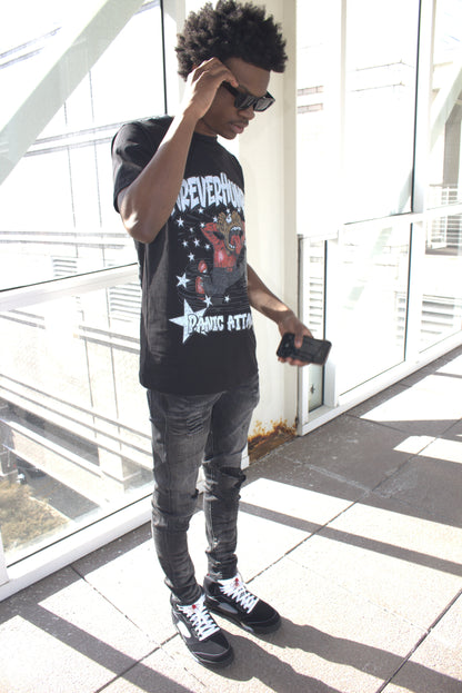 Person wearing a graphic t-shirt 'panic attack'