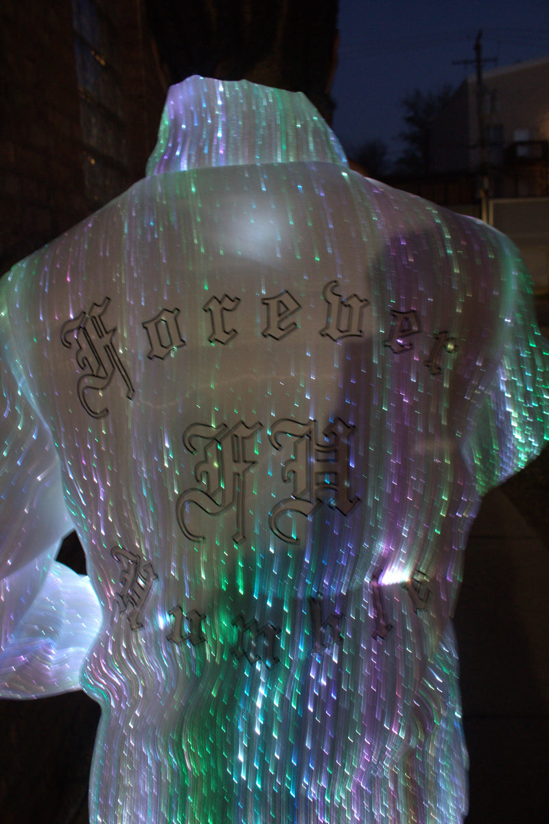 Illuminated bow with 'Krebs' branding on a dark background