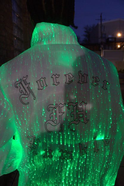 Green illuminated object with Chinese characters on a puffer jacket